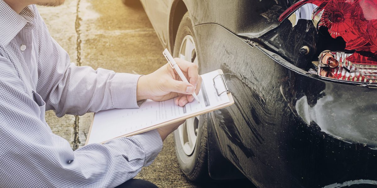 Insurance agent working on car accident claim process